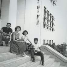  Fred Smith, Edna Johns, Geneva Shore, and Jimmy Scott Osceola sitting on what appears to be the front steps of Okeechobee High School in Okeechobee, Florida where the four graduated.
